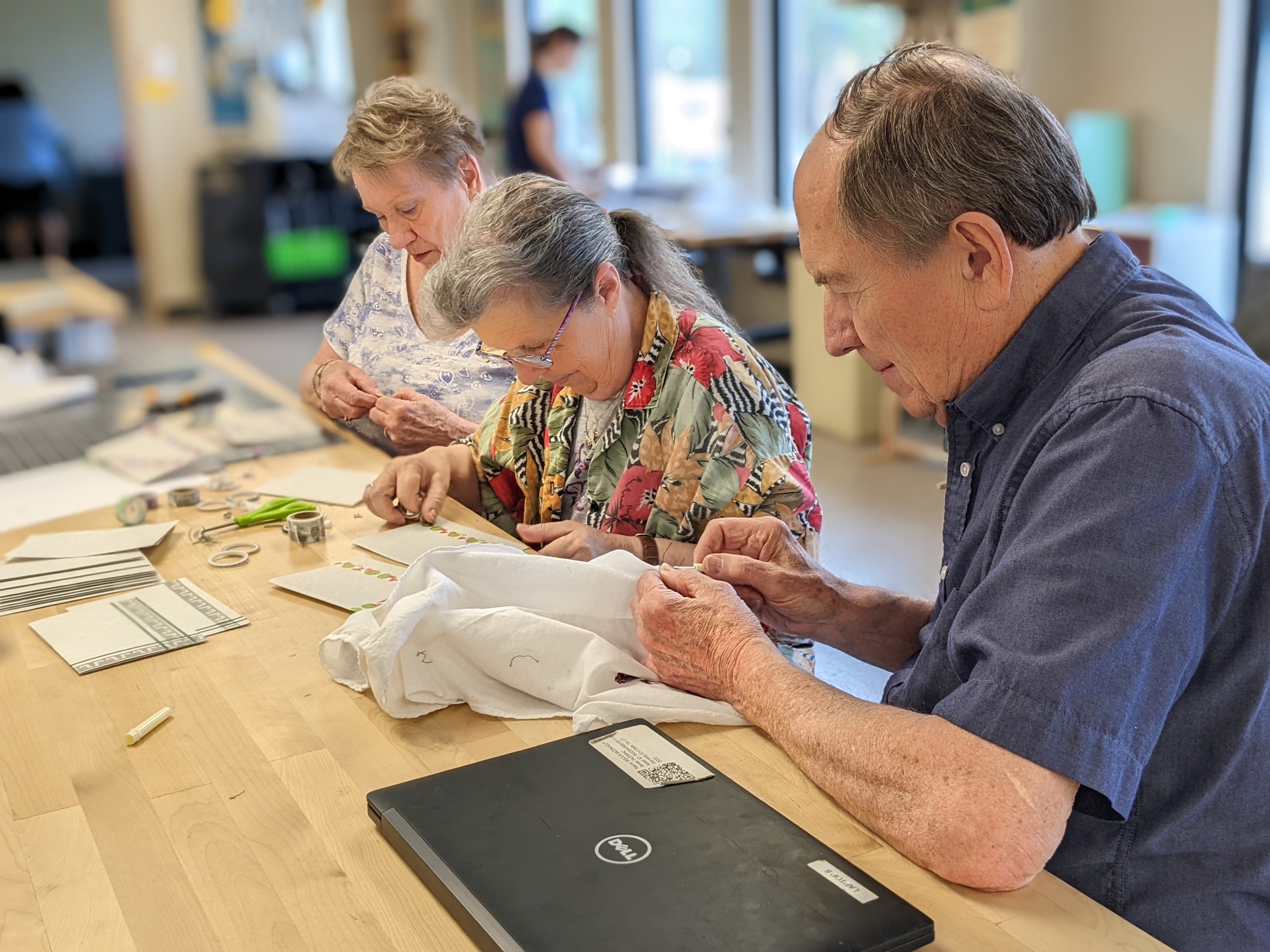 Older adults working on craft projects together