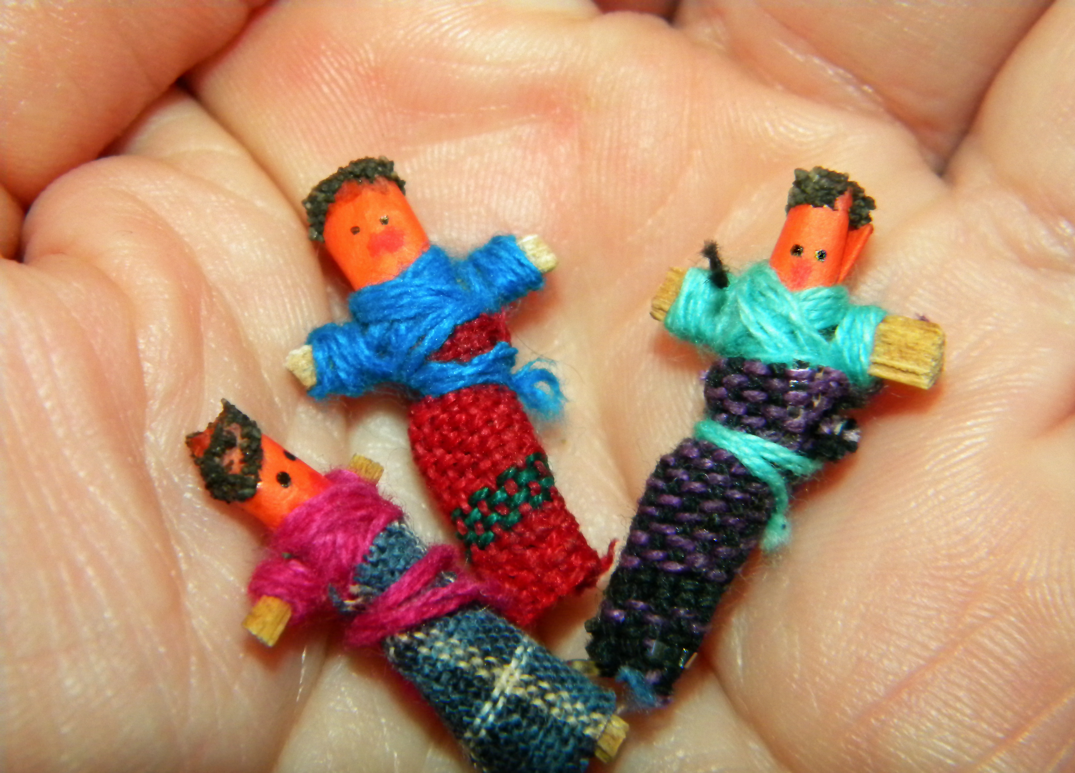 Small Worry Dolls being held