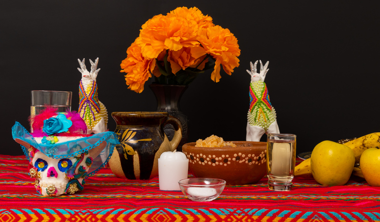 picture of ofrenda, including marigolds and sugar skulls