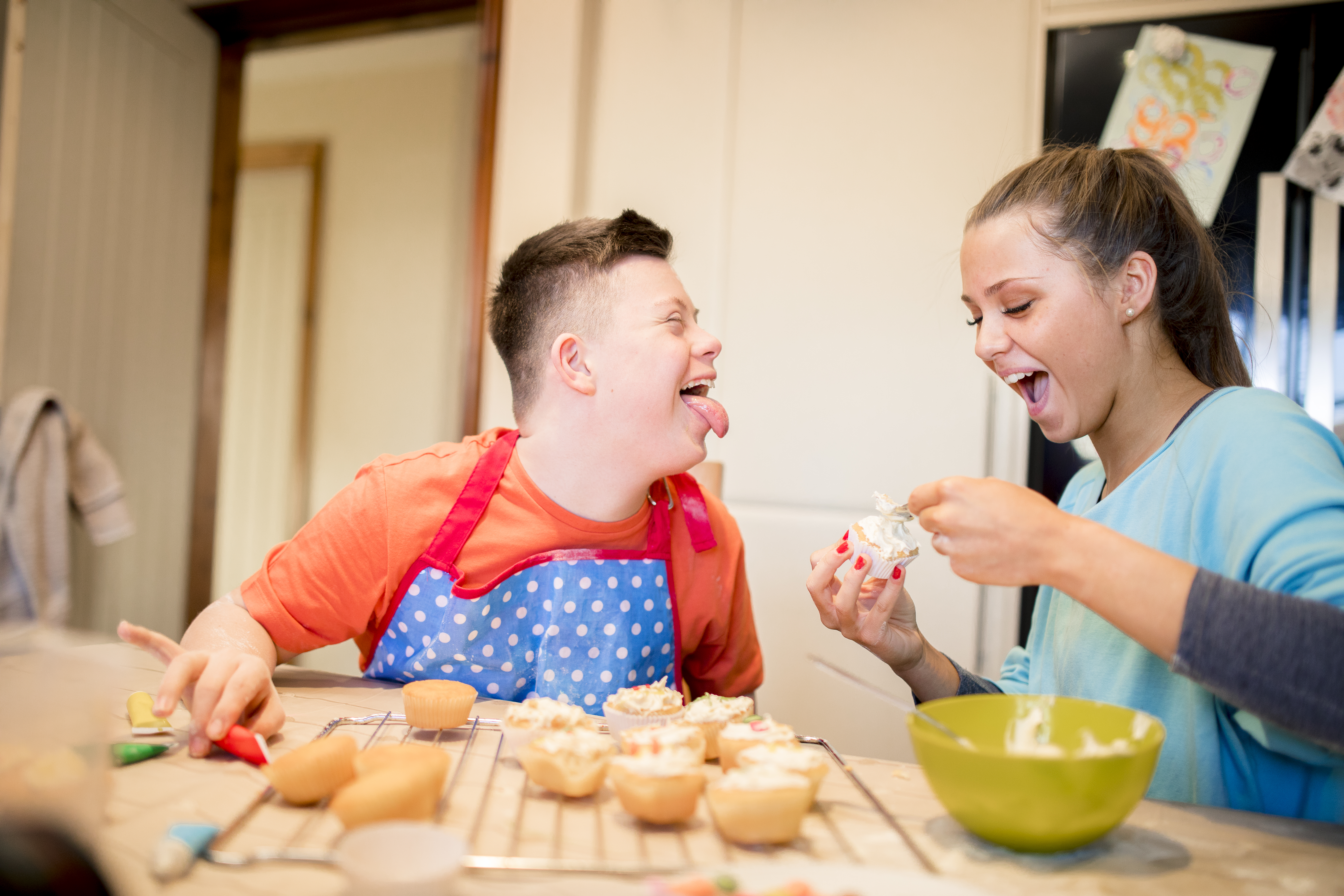 Boy with down syndrome bakes cakes with his sister