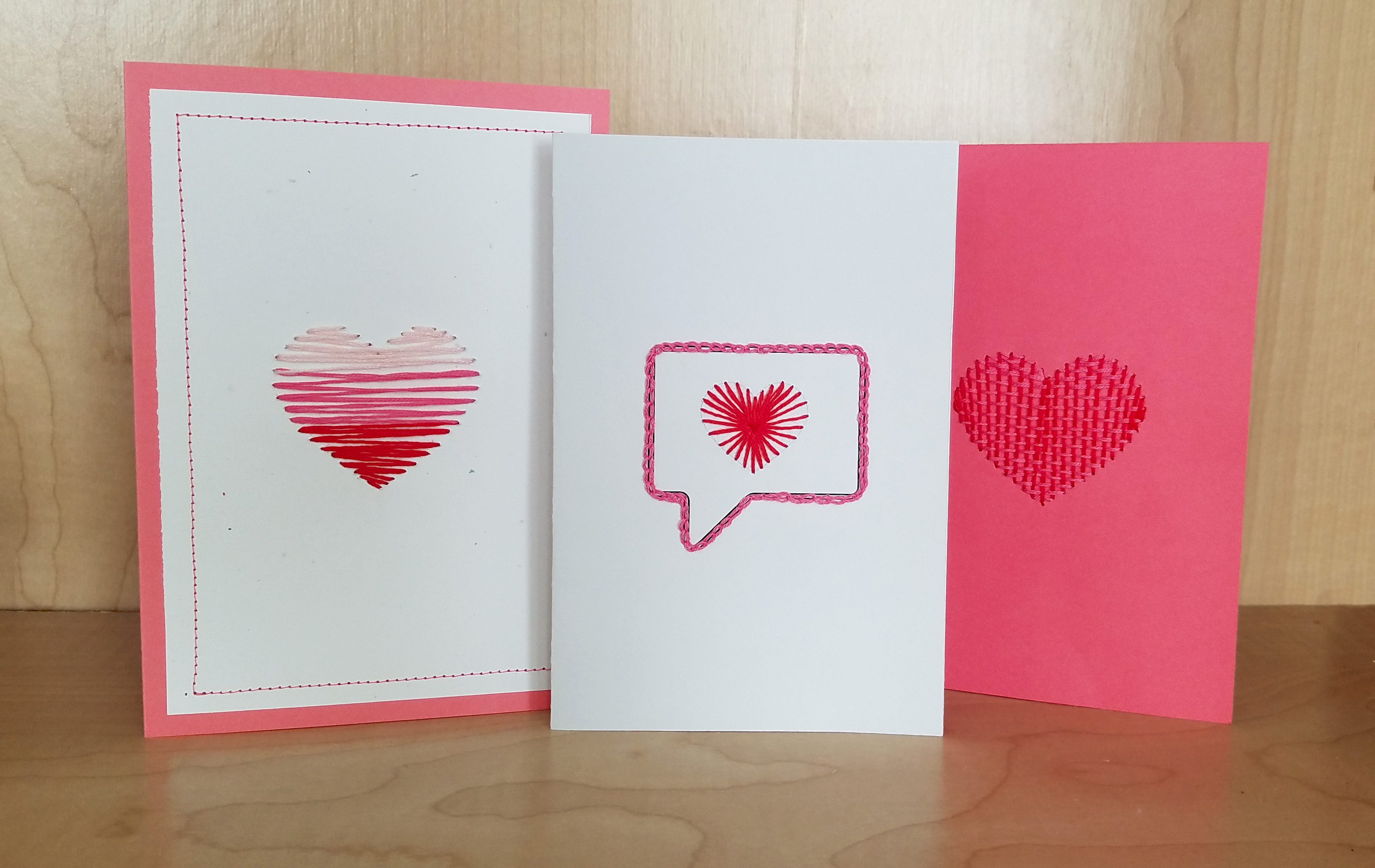 3 hand embroidered Valentine cards with hearts made of embroidery floss