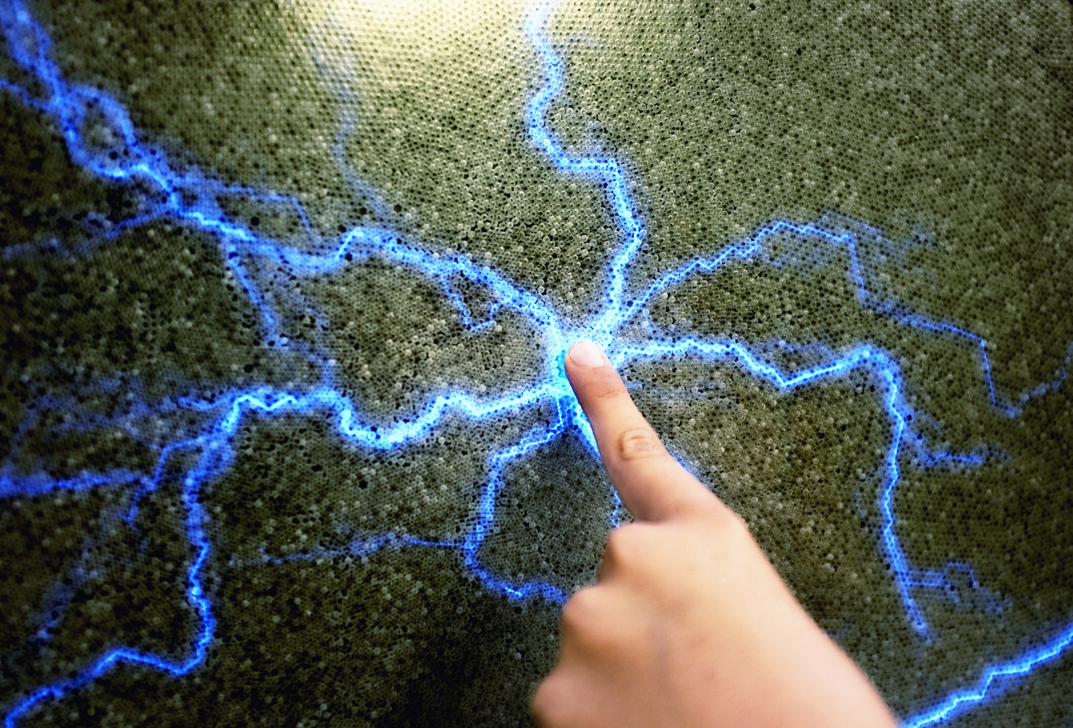 Child finger creating static electricity