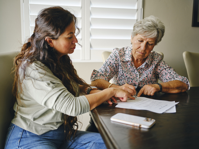 Patient and caregiver reviewing documents