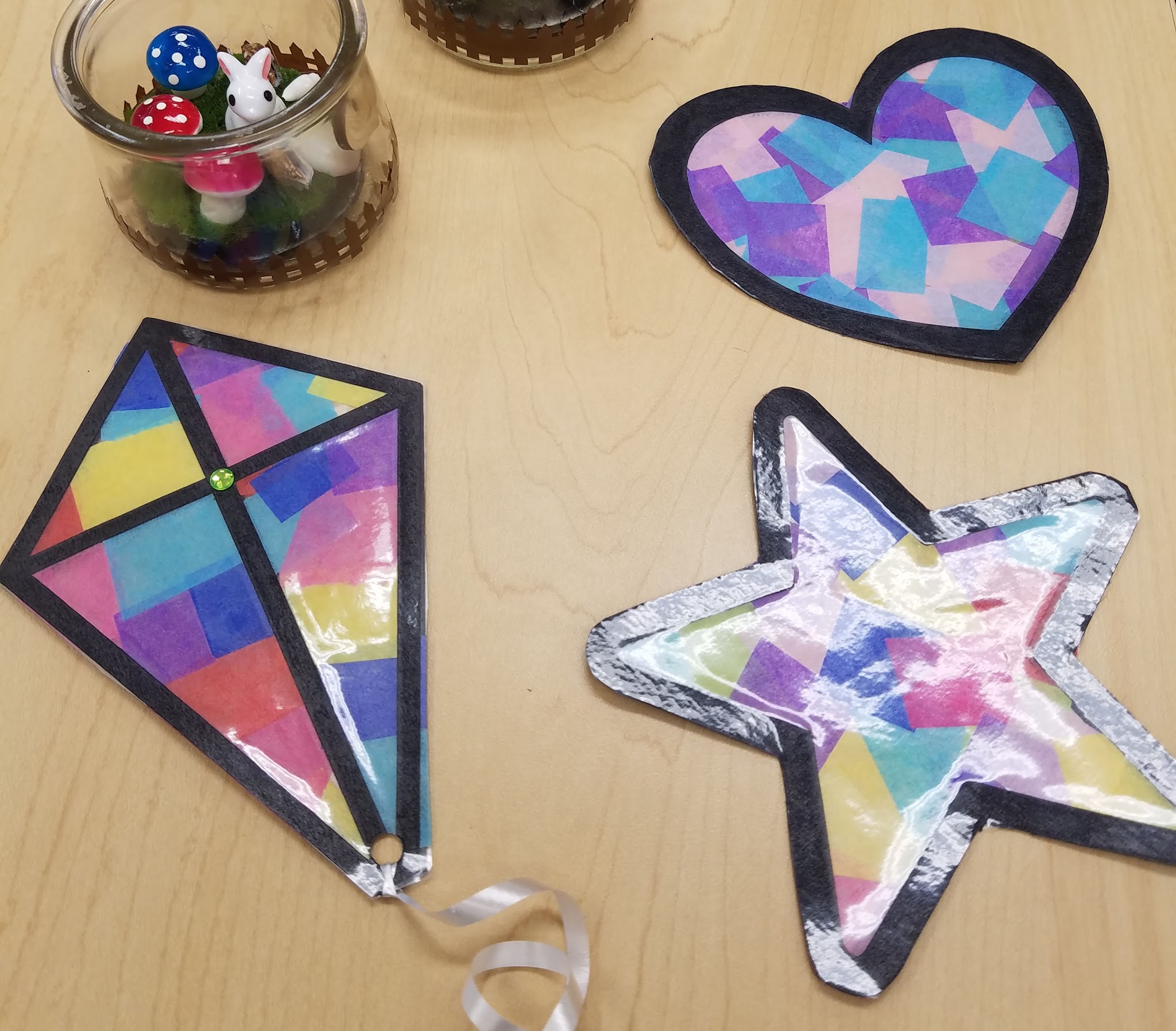 faux stained glass suncatcher in the shape of a kite, star, and heart