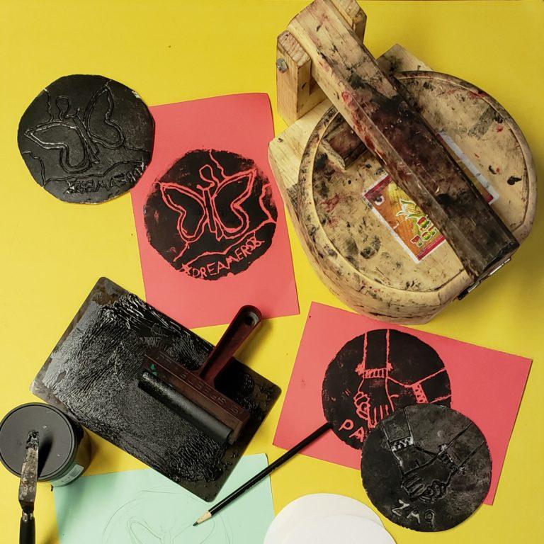 An example of printmaking using stamps and ink.
