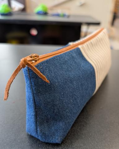 Denim and striped canvas pencil case with gusset and leather zipper pull.