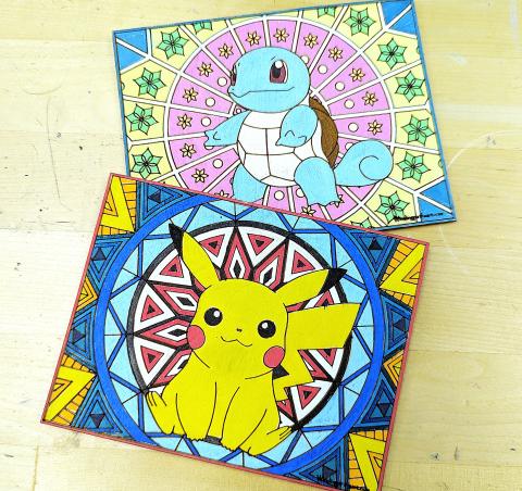 Two laser-etched Pokemon graphics, one of Squirtle and one of Pikachu, with geometric patterns behind them, painted in vibrant colors