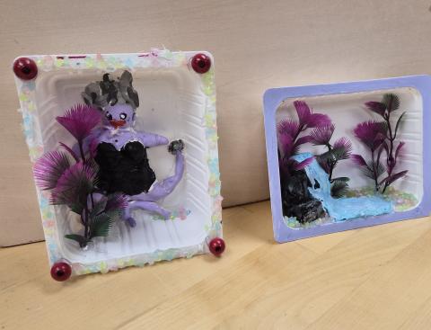 2 dioramas with purple plants and a mermaid