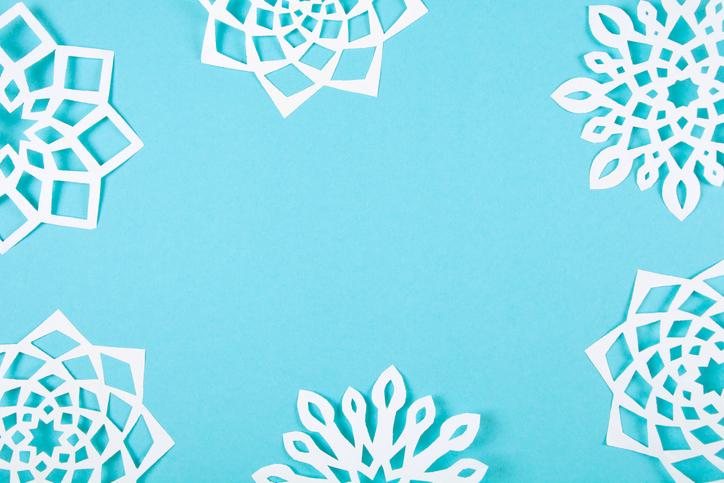 paper snowflakes on blue background