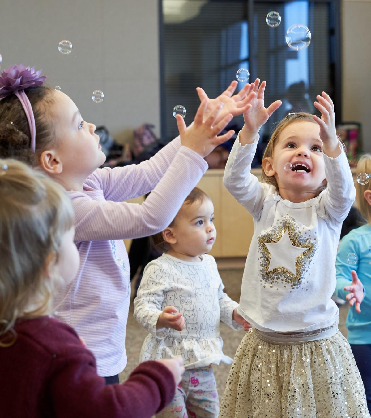 Kids playing with bubbles