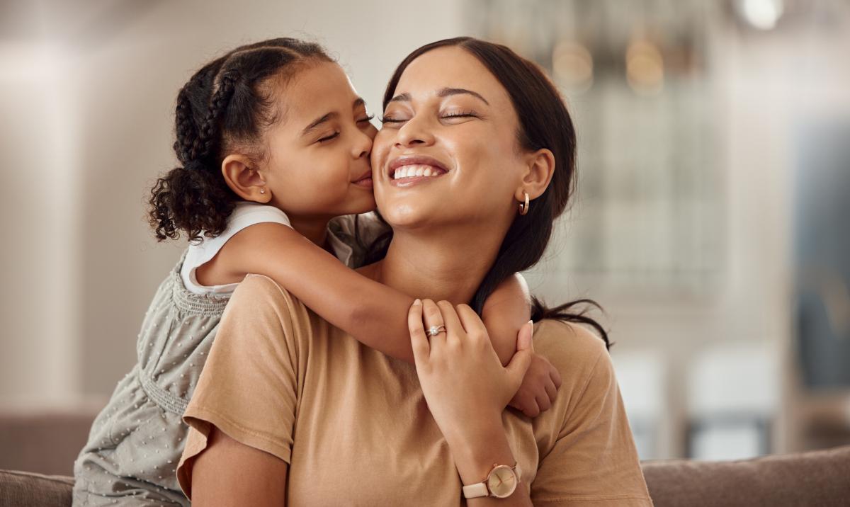 Happy parent and happy child hugging