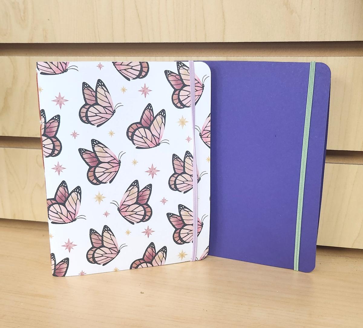 Two handmade journals with elastic straps