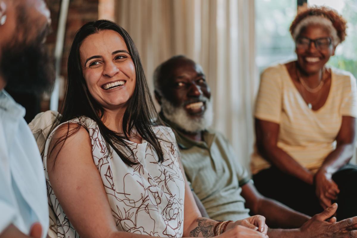 People in conversation looking happy
