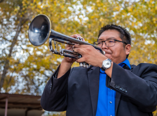 photo of Delbert Anderson playing his trumpet